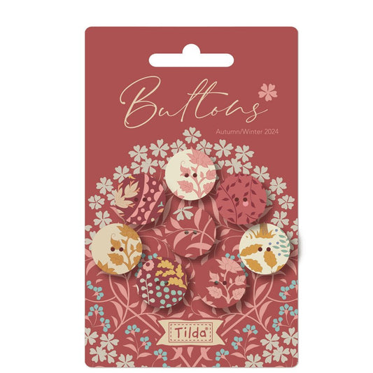 Pack of 8 fabric covered metal buttons with a floral pattern, displayed on a pink card with the brand name 'Tide'.